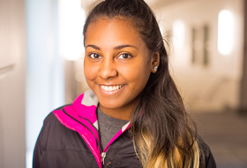 Female student standing the hallway of the Zappala College Center at La Roche College.